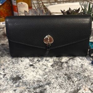 Kate Spade Black Wallet with Pebbled Texture and Spade Emblem